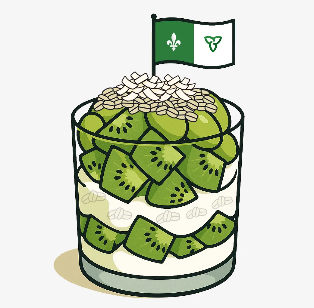 Une verrine contenant, de façon étagée, du yogourt blanc, des flocons d’avoine, des morceaux de kiwi et des raisins verts. Sur le dessus, il y a des flocons de noix de coco et un petit drapeau franco-ontarien planté au sommet.